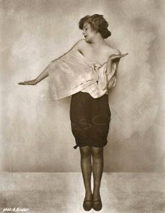Anita Berber in one of her more sedate costumes, with knickers about the knees and a draped top that suggests it will drop and expose her breasts if she moves.