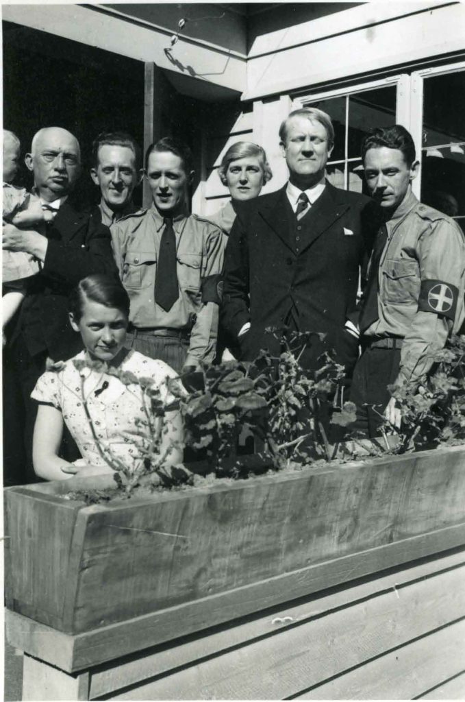 Vidkun Quisling standing on a balcony with members of the Norwegian Nazi party 1935